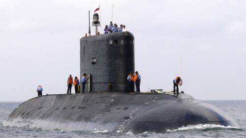 Submarine half-breeched with workers.
